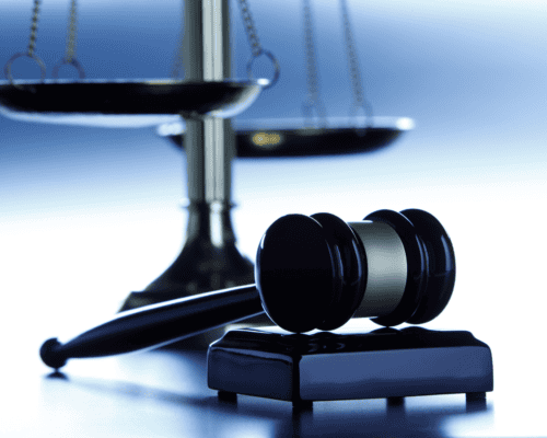 Judge's gavel and scales of justice symbolize federal eminent domain proceedings, property rights disputes, condemnation lawsuits, and the legal process involved in challenging a government taking in federal court in Los Angeles.