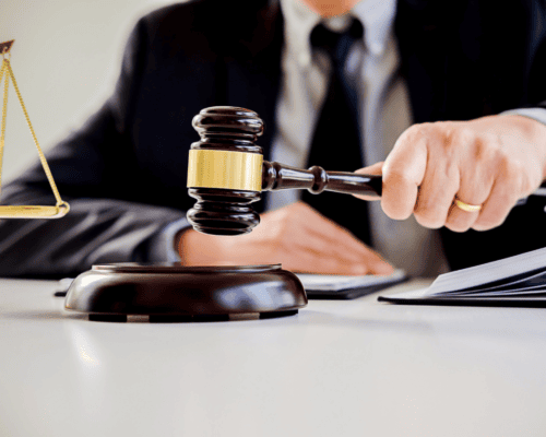 Judge's gavel, scales of justice, and legal documents represent federal eminent domain negotiations, property rights, just compensation, government land acquisition, condemnation proceedings, and legal advocacy for Southern California property owners.